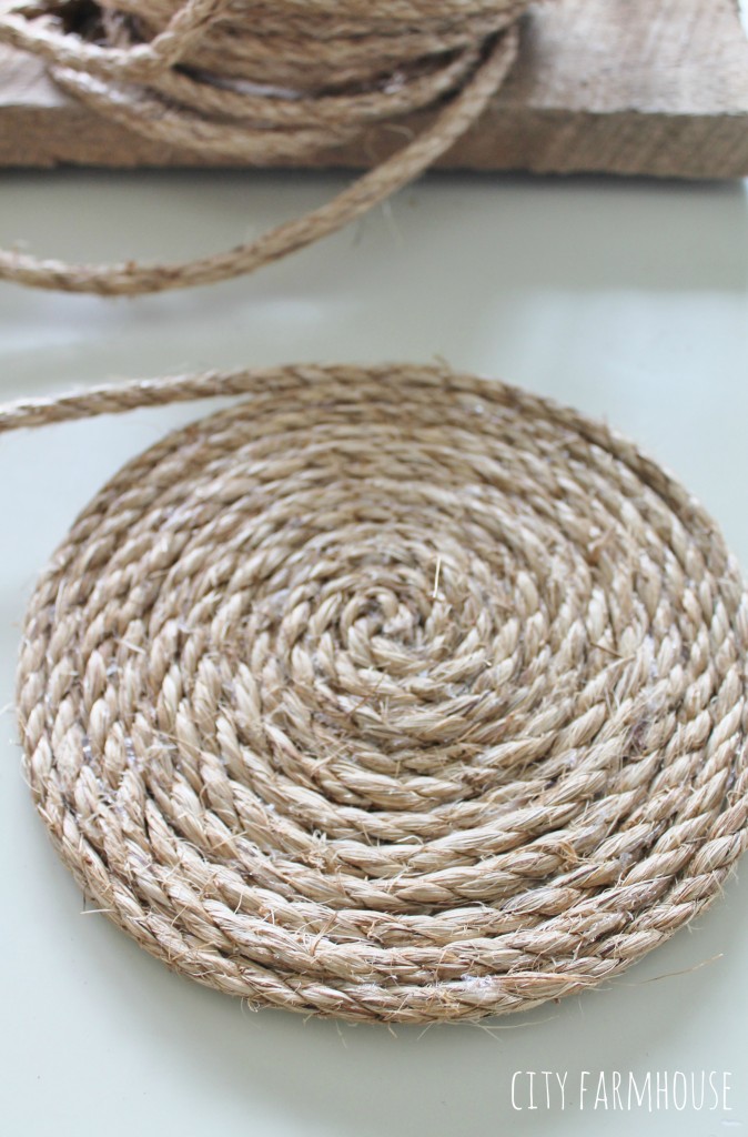 Pottery Barn Inspired Round Jute Placemats- Using hot glue gun wrap jute all the way around