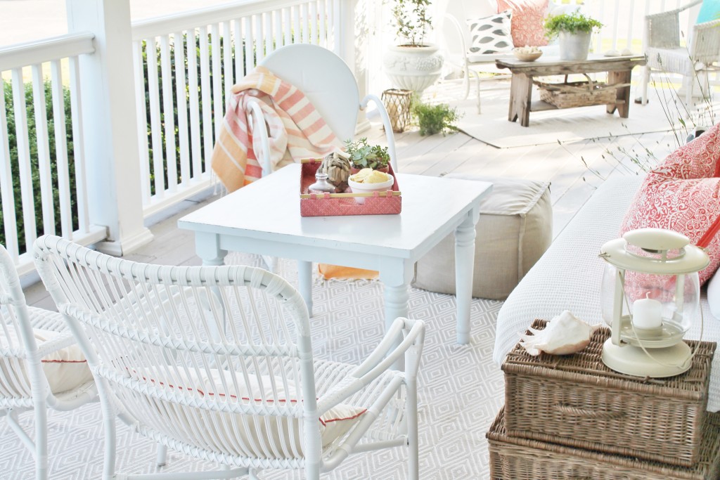 Mix white wicker with worn wood for a crisp, cottage summer look