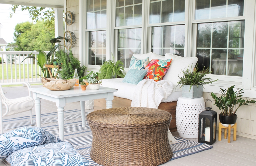 Front POrch Mini Makoever, New Navy Front Door, Rug From Dash & Albert, Wicker Ottoman & Floor Pillows