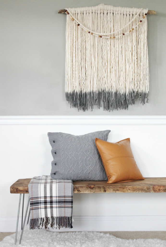 simple modern farmhouse holiday bedroom. Christmas decorating. Pine cone wreath, fresh greenery, plaid & cozy details