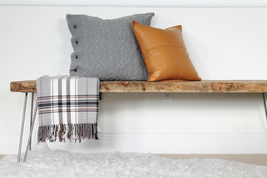 simple modern farmhouse holiday bedroom. Christmas decorating. Pine cone wreath, fresh greenery, plaid & cozy details