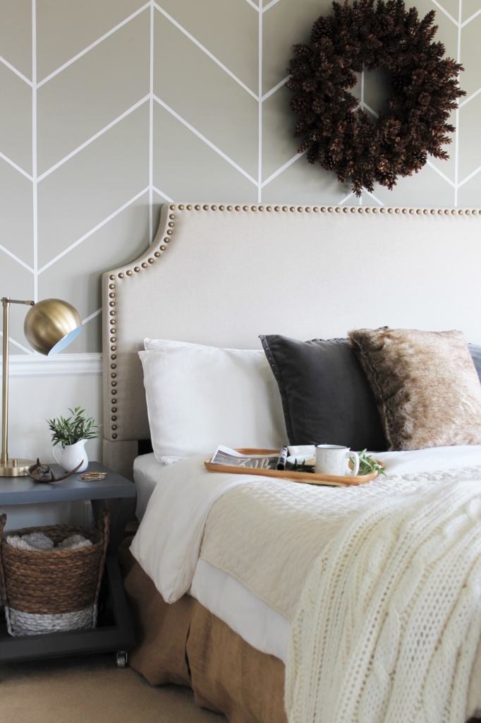 simple modern farmhouse holiday bedroom. Christmas decorating. Pine cone wreath, fresh greenery, plaid & cozy details