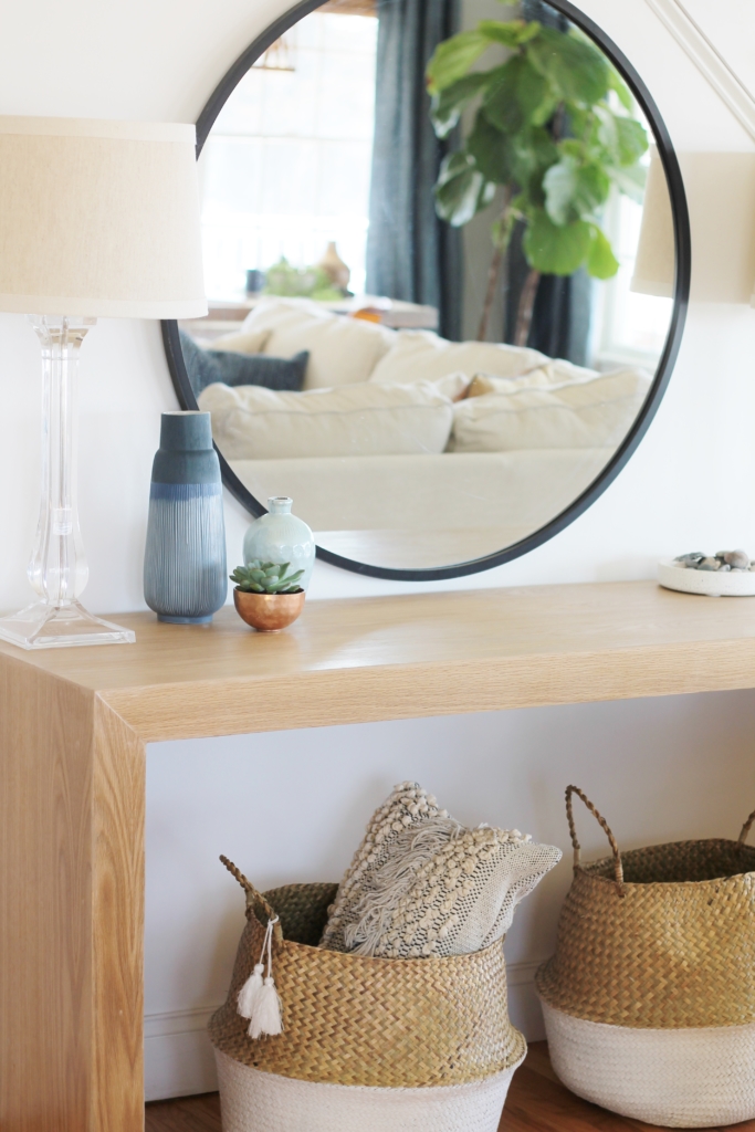 Waterfall Console Table With Round Mirror Reveal, Minwax Polycrylic Finish. Family Room Makeover with White Walls. Custom Made Console Table in White Oak-City Farmhouse