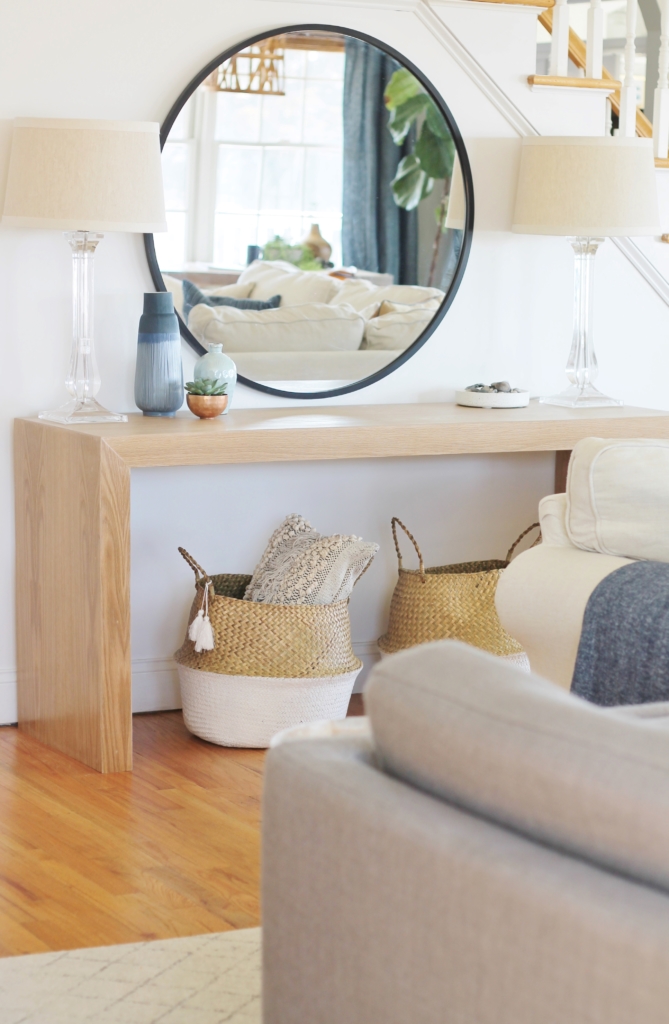 Waterfall Console Table With Round Mirror Reveal, Minwax Polycrylic Finish. Family Room Makeover with White Walls. Custom Made Waterfall Console Table in White Oak-City Farmhouse