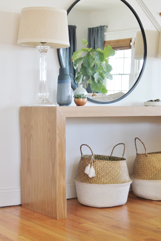 Waterfall Console Table With Round Mirror Reveal, Minwax Polycrylic Finish. Family Room Makeover with White Walls. Custom Made Console Table in White Oak-City Farmhouse