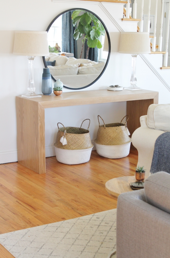 Waterfall Console Table With Round Mirror Reveal, Minwax Polycrylic Finish. Family Room Makeover with White Walls. Custom Made Console Table in White Oak-City Farmhouse