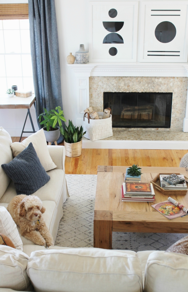 Details On My White Family Room: Paint, Curtains, Art + More. Sherwin-Williams Snowbound. Abstract Black & White Art. Linen Sectional Ikea. Waterfall Table. Indigo Curtains. City Farmhouse