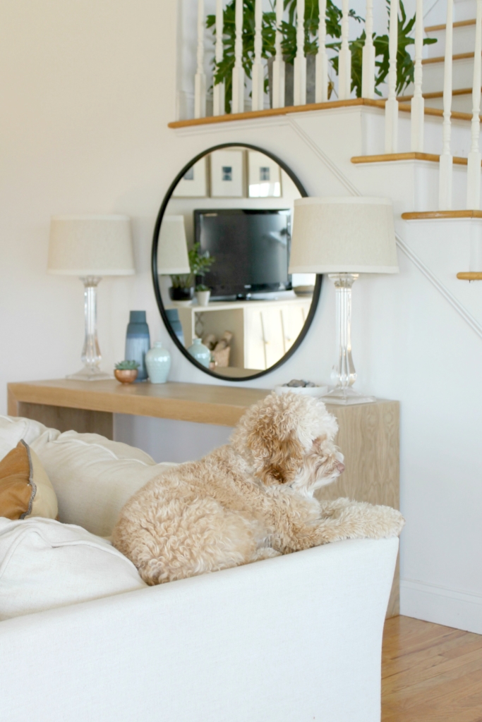 Details On My White Family Room: Paint, Curtains, Art + More. Sherwin-Williams Snowbound. Abstract Black & White Art. Linen Sectional Ikea. Waterfall Table. Indigo Curtains. City Farmhouse