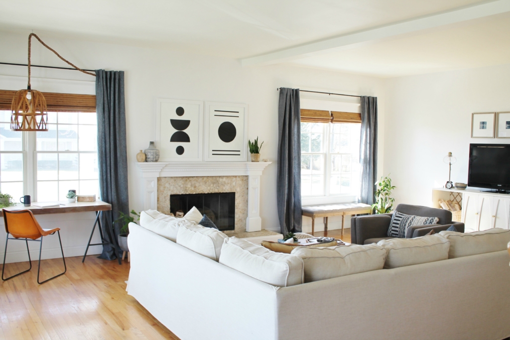 Details On My White Family Room: Paint, Curtains, Art + More. Sherwin-Williams Snowbound. Abstract Black & White Art. Linen Sectional Ikea. Waterfall Table. Indigo Curtains. City Farmhouse