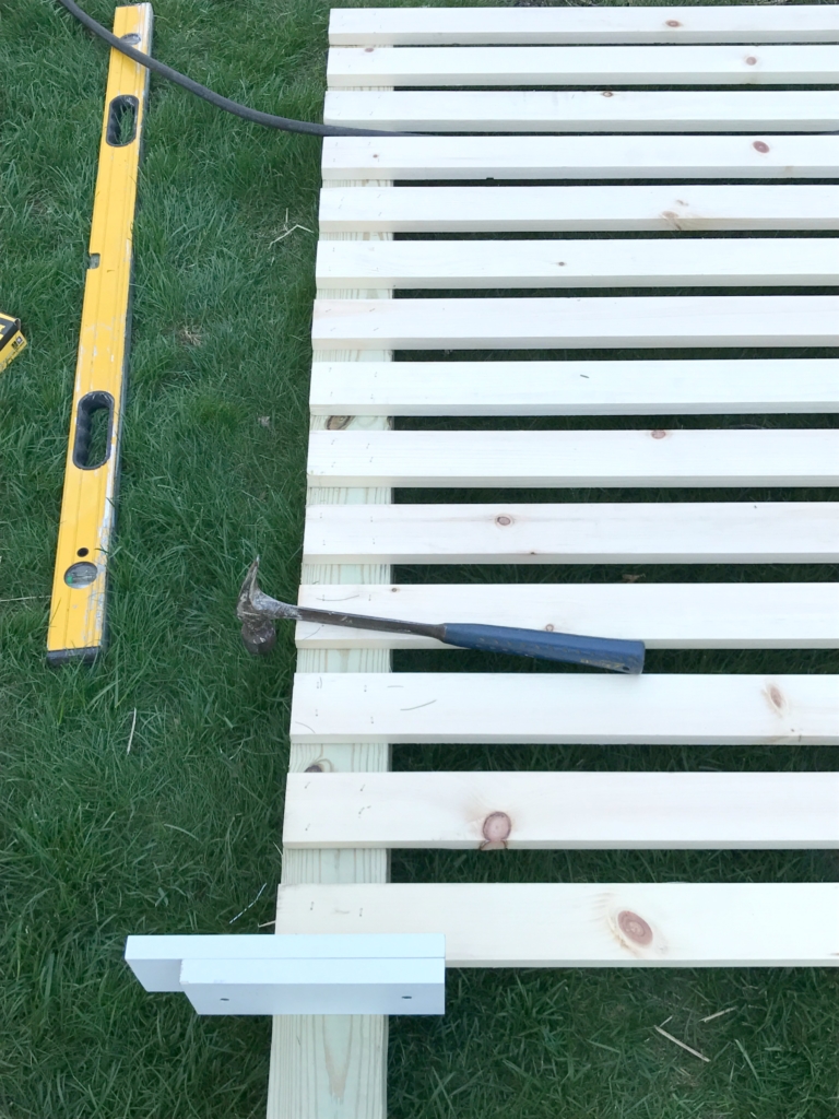 DIY Outdoor Screen:Use spacers to allows for evenly placed slats