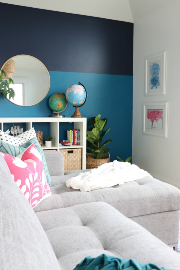 modern sofa bed-Soma by Article in Dawn Gray. Playroom updates including brass sconces & rattan pendant. Rattan side tables with navy striped rug.