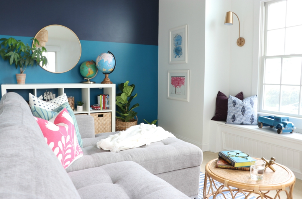 modern sofa bed-Soma by Article in Dawn Gray. Playroom updates including brass sconces & rattan pendant. Rattan side tables with navy striped rug.