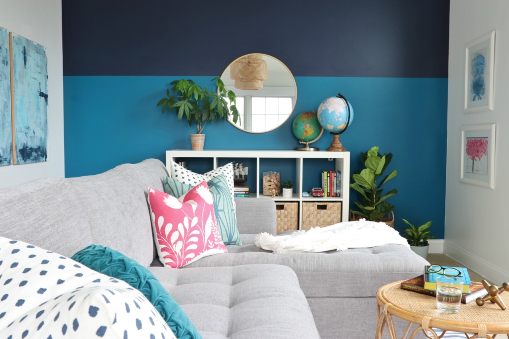 modern sofa bed-Soma by Article in Dawn Gray. Playroom updates including brass sconces & rattan pendant. Rattan side tables with navy striped rug.