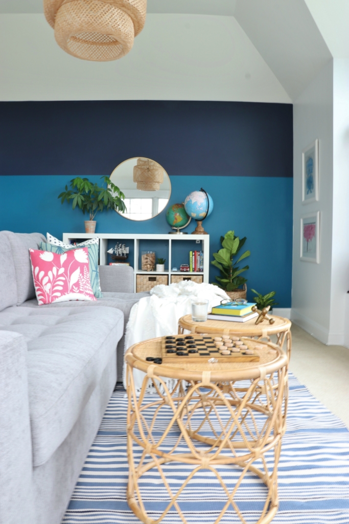 modern sofa bed-Soma by Article in Dawn Gray. Playroom updates including brass sconces & rattan pendant. Rattan side tables with navy striped rug.