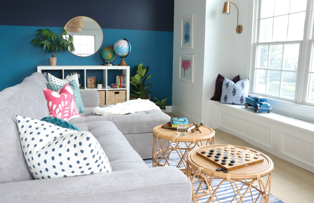 modern sofa bed-Soma by Article in Dawn Gray. Playroom updates including brass sconces & rattan pendant. Rattan side tables with navy striped rug.