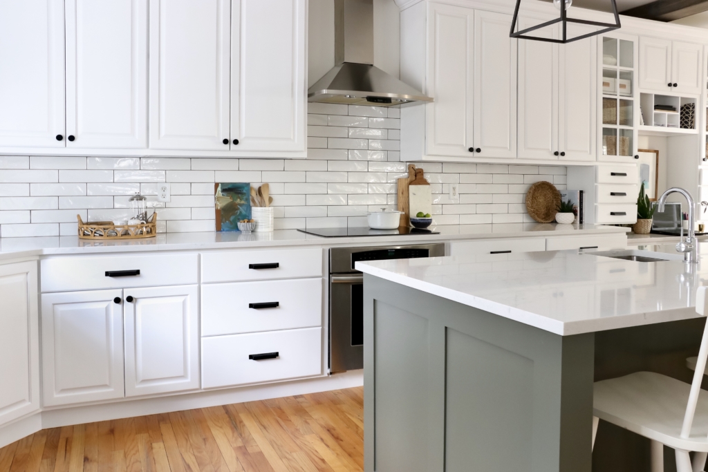 White Kitchen Reveal-HanStone Quartz in Montauk-Chantilly Lace-Cast Iron-White Cabinets-Wood Beams-Budget Friendly Kitchen Renovation-Earthy Coastal Kitchen Makeover-White Cabinets Black Hardware-Indigo Runner