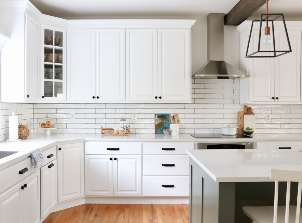 White Kitchen Reveal-HanStone Quartz in Montauk-Chantilly Lace-Cast Iron-White Cabinets-Wood Beams-Budget Friendly Kitchen Renovation-Earthy Coastal Kitchen Makeover-White Cabinets Black Hardware-Indigo Runner