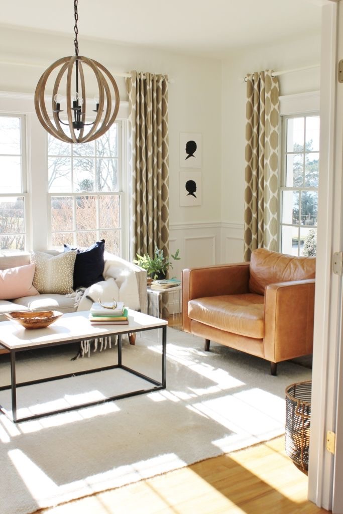 Neutral Den-White walls, Leather chairs and linen sofa