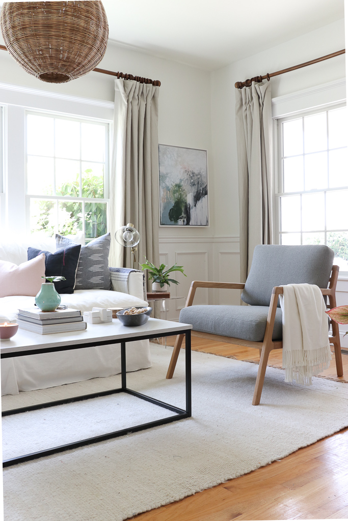 Denman Chair Article, White Slipcovered sofa, Woven Shade, White Walls, City Farmhouse & Co Pillows, Hats on Wall, Indigo Pillows, Lindsay Letters Art