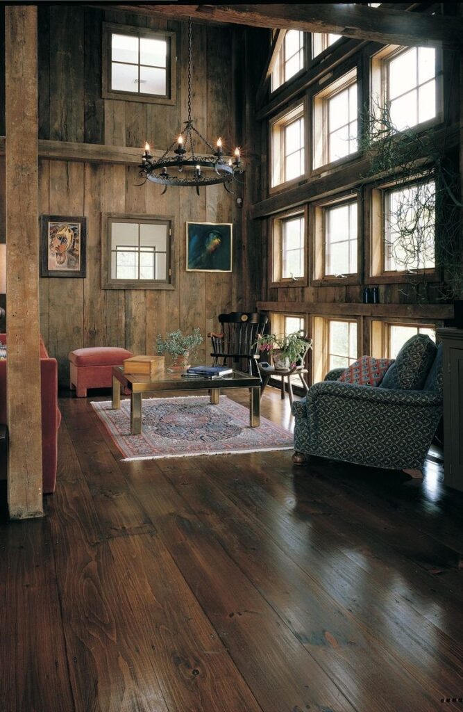 Carlisle Wide Plank Floors. Reclaimed Barnwood with Eastern White Pine in a Rustic Living Room.