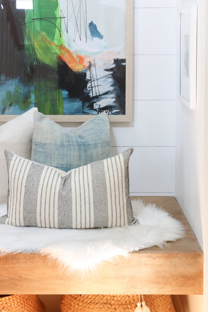 Modern Coastal Summer Nook With New Abstract Painting. Pillows from City Farmhouse and Co,