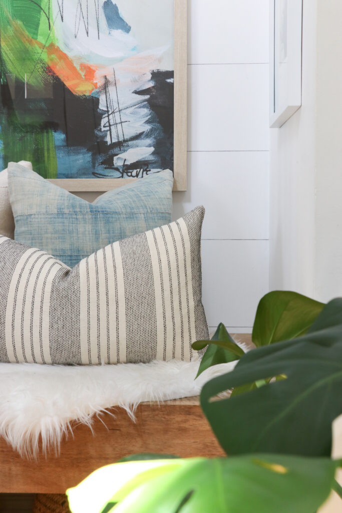 Modern Coastal Summer Nook With New Abstract Painting. Pillows from City Farmhouse and Co,