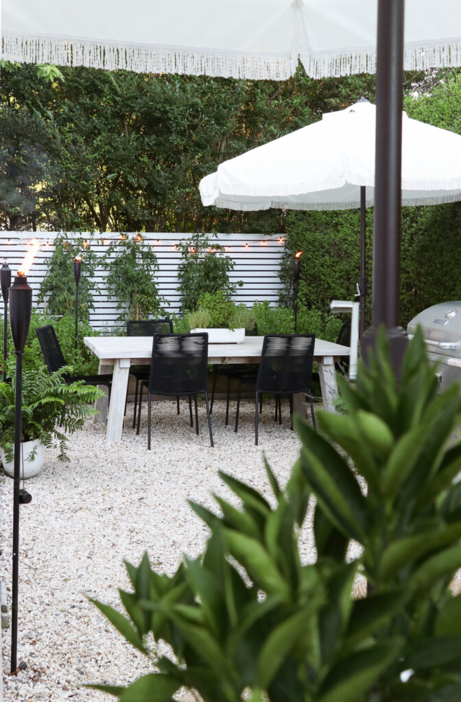 California Casual, Palm Springs Inspired Pea Gravel Patio. Zina Outdoor dining chairs from Article.