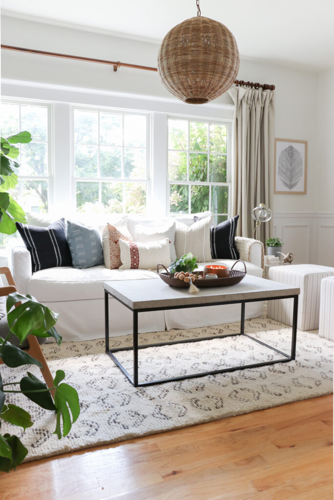 City Farmhouse by Jennifer OBrien Modern Coastal Home Tour. Black French Doors, Rattan Pendant Light.