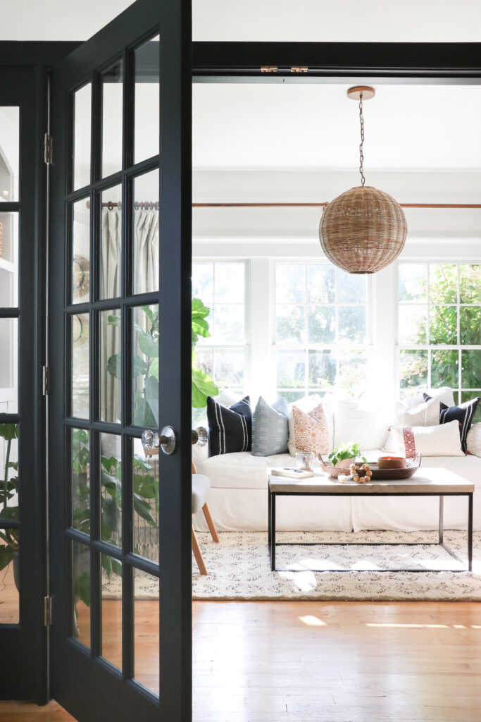 City Farmhouse by Jennifer OBrien Modern Coastal Home Tour. Black French Doors, Rattan Pendant Light.