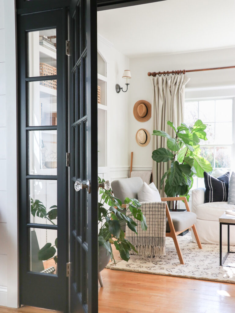 City Farmhouse by Jennifer OBrien Modern Coastal Home Tour. Black French Doors, Rattan Pendant Light.