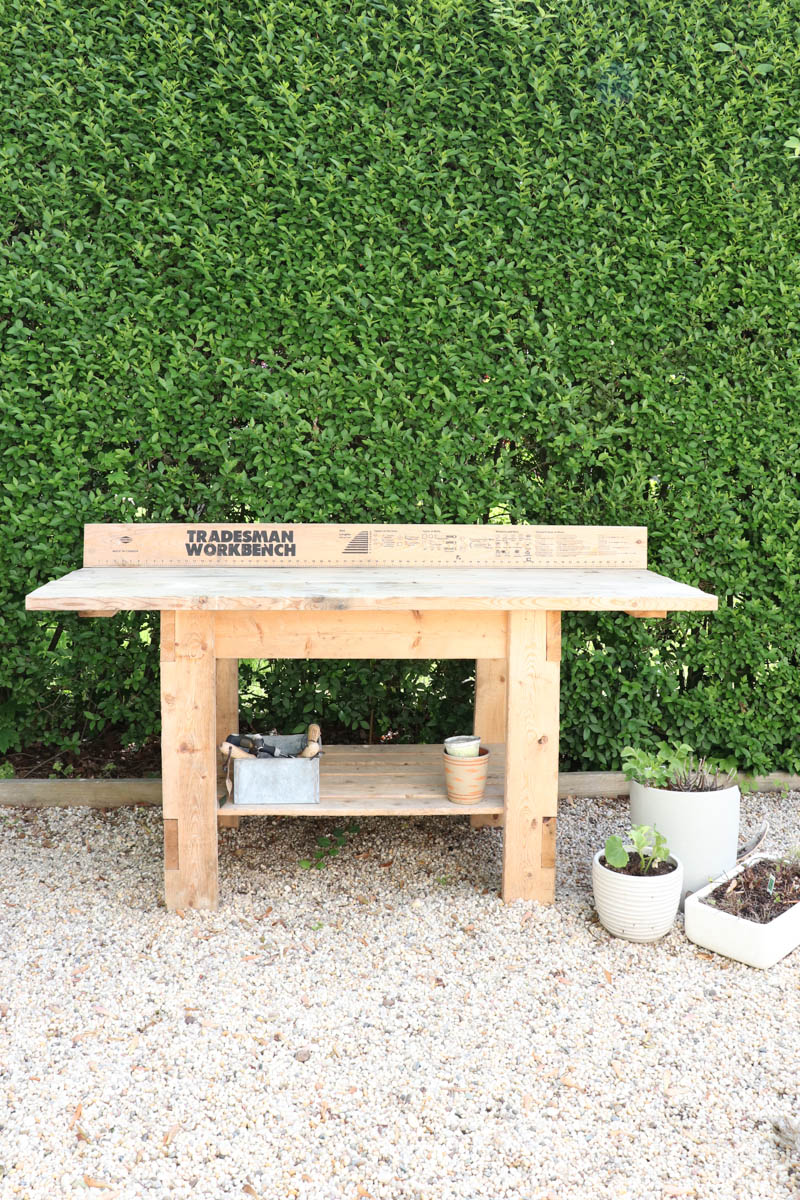 City Farmhouse by Jennifer OBrien. Free workbench turned into potting bench + outdoor bar. DIY pea gravel patio. Boothbay Gray by Benjamin Moore.