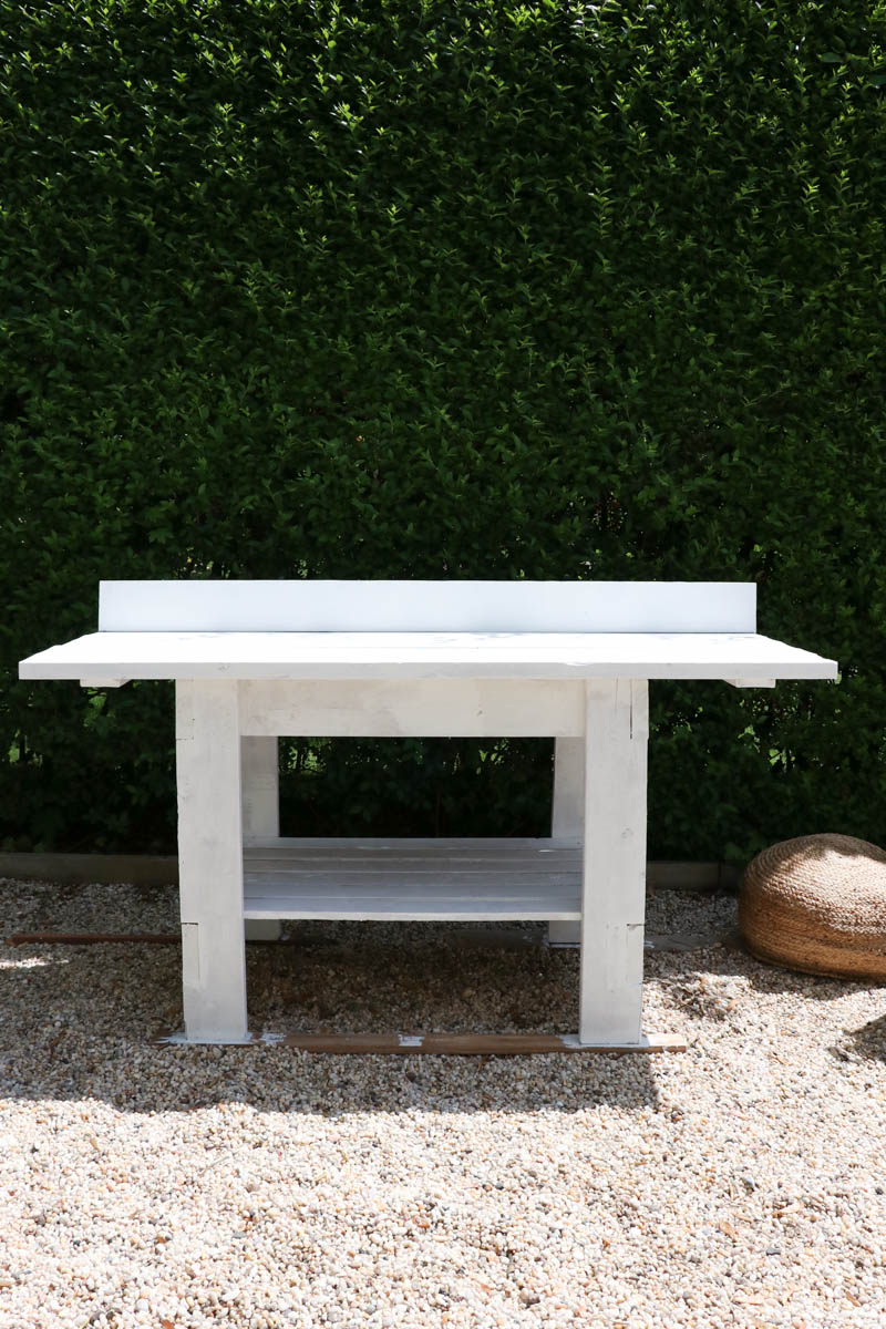 City Farmhouse by Jennifer OBrien. Free workbench turned into potting bench + outdoor bar. DIY pea gravel patio. Boothbay Gray by Benjamin Moore.