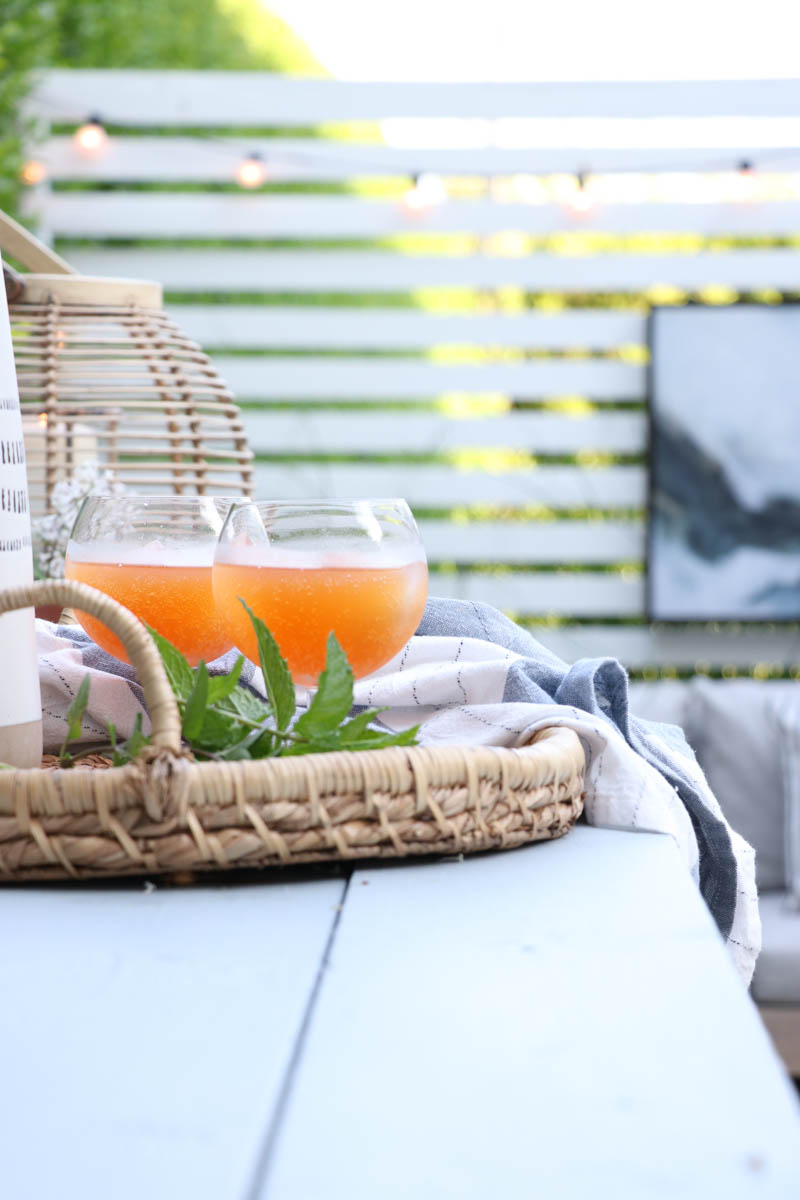 City Farmhouse by Jennifer OBrien. Free workbench turned into potting bench + outdoor bar. DIY pea gravel patio. Boothbay Gray by Benjamin Moore.