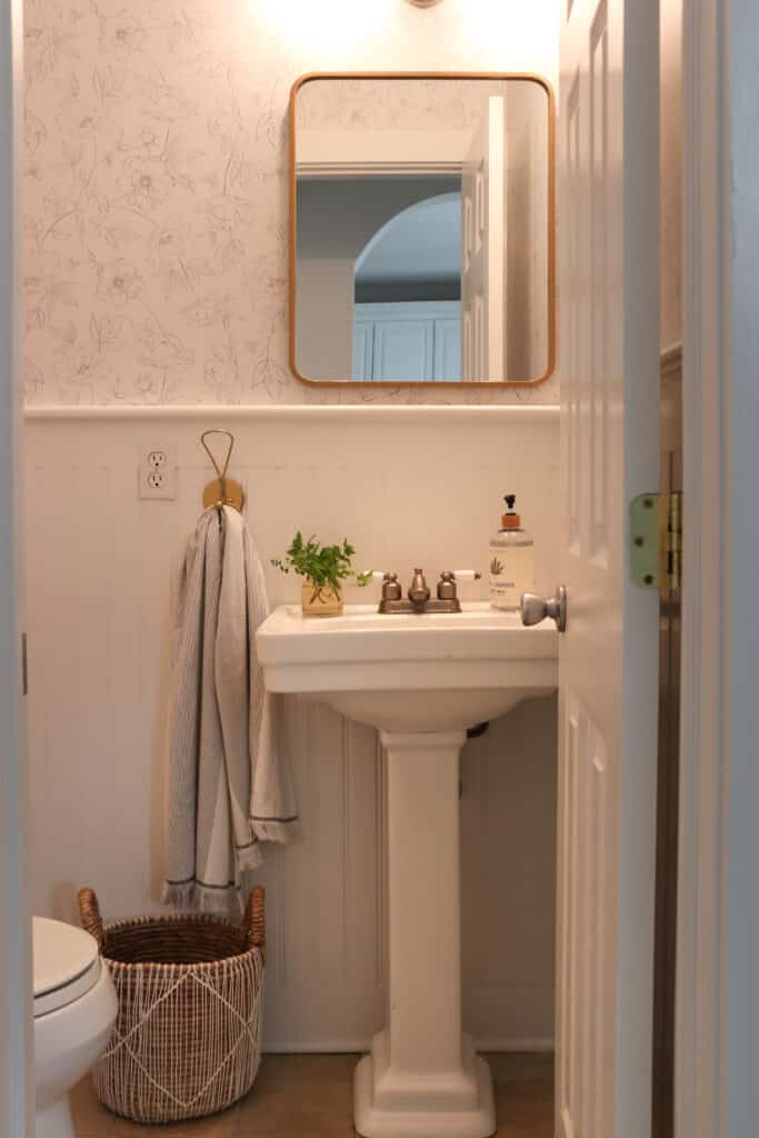 10 Livable Interior Design Trends for 2023. City Farmhouse by Jennifer OBrien. Botanical wallpaper bathroom.