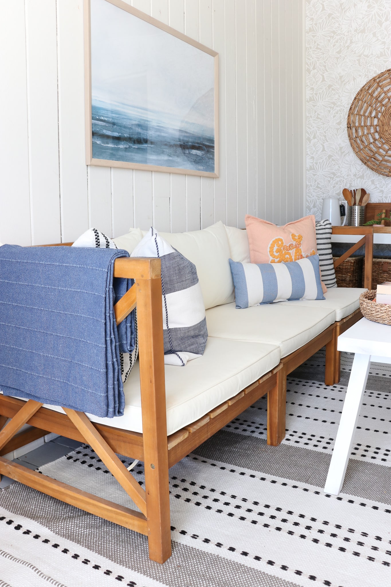 Beach Cabana Makeover With botanical wallpaper, striped rug, Ikea bench and blue refrigerator. 