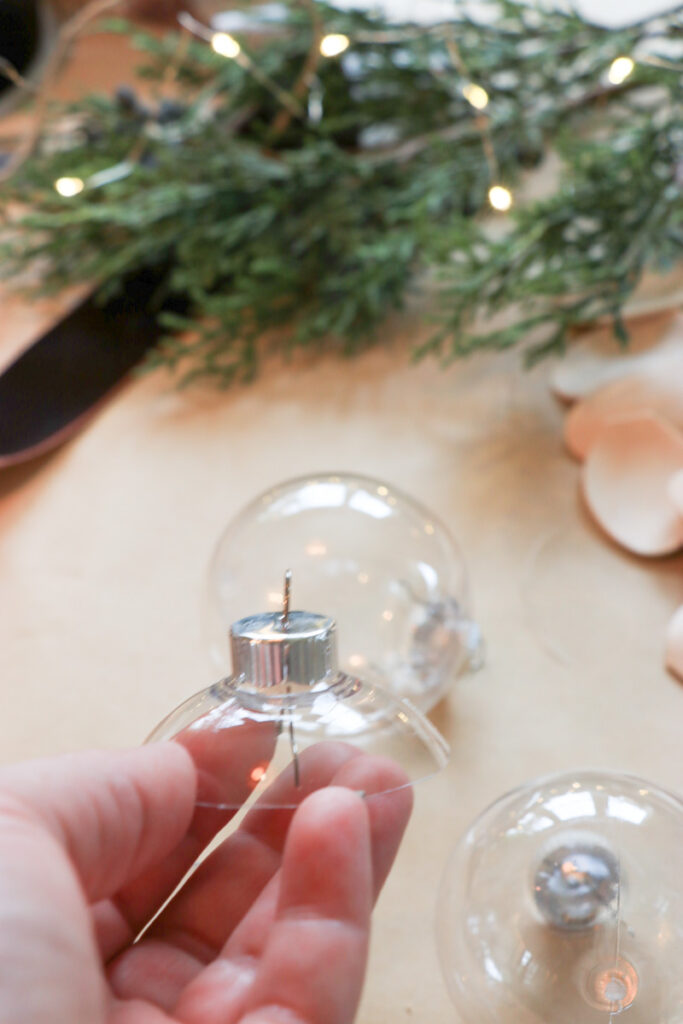 DIY Christmas bells for your mantel, wreath, staircase, or tree. You'll need 8 wooden spoons per bell and a round ornament to make these Lotus Bells. 