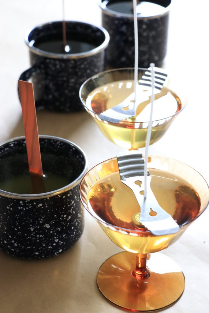 anthropologie inspired diy candles you'll want to save. thrifted enamelware used as campfire candles.