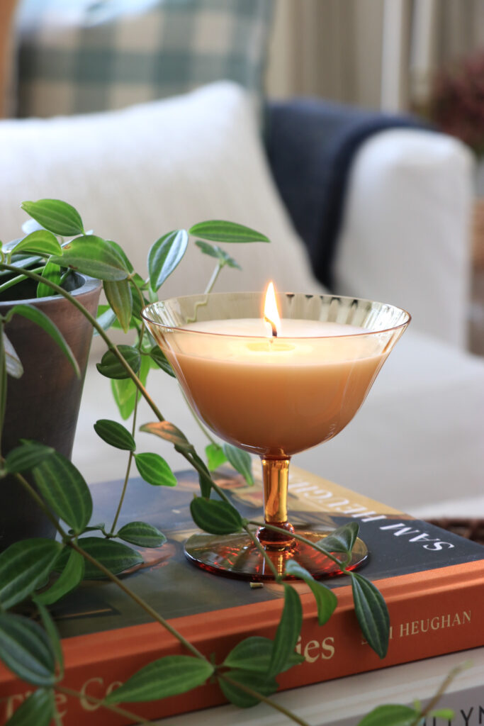 anthropologie inspired diy candles you'll want to save. thrifted amber glasses used as coupe candles. what would dahlia make-city farmhouse