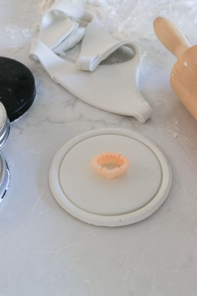 make this, chambray coastal clay coasters. use a shell cutter to make an insert in the middle.